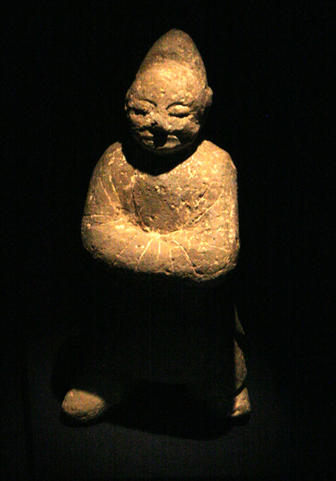 Cone head figurine